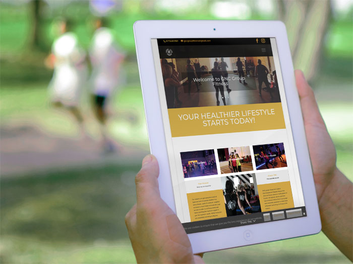 GNC Group Fitness website on a tablet device
