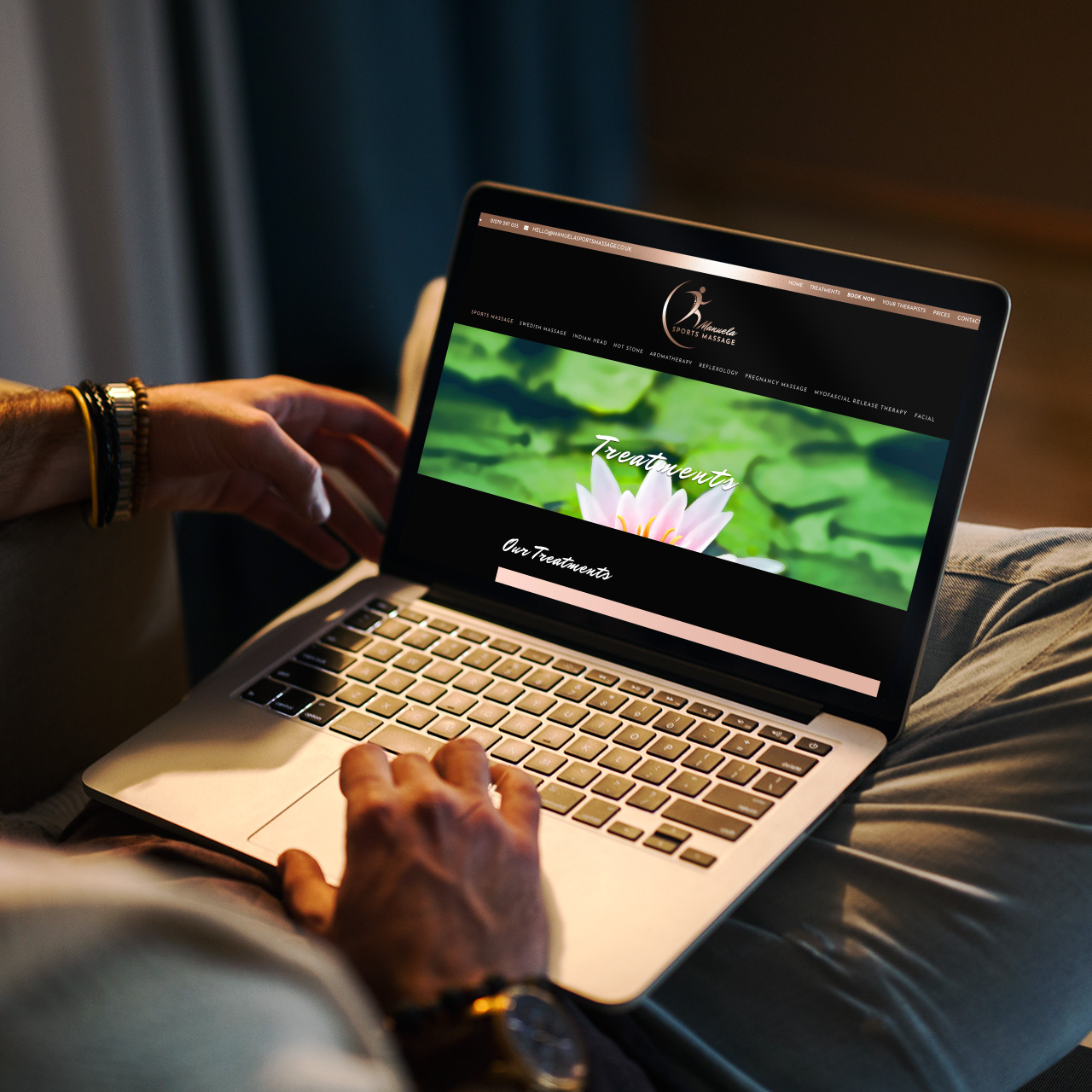 manuela sports massage website on a laptop